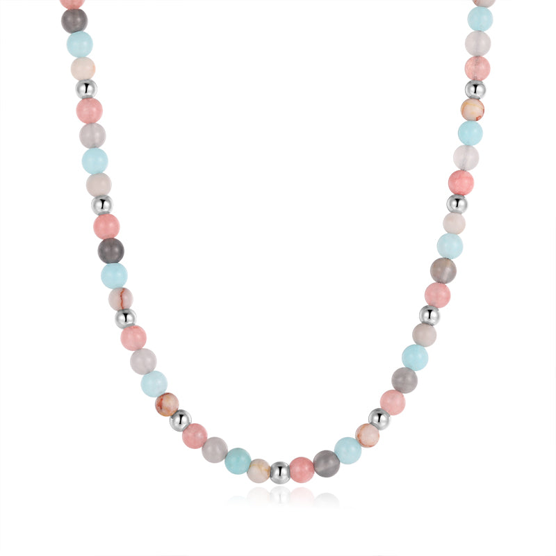The Kette Pellworm (4mm) necklace combines Pink Jade, Quarz-Kristall, and Roter Netz Jaspis beads, inspired by Quarz-Kristall Schmuck and shown on a white background.