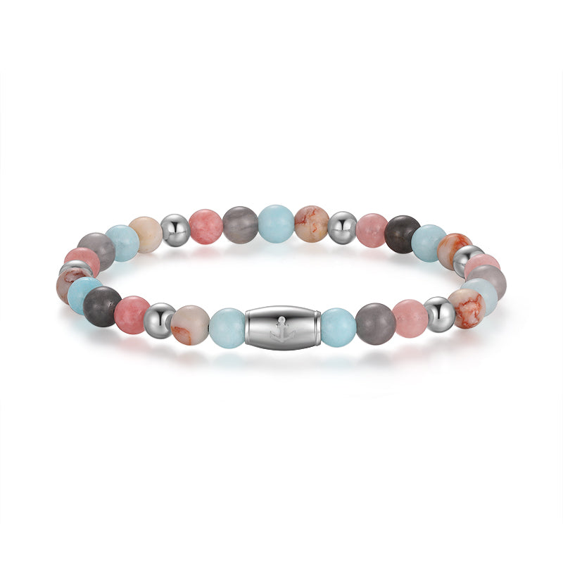 The Armband Pellworm features Pink Jade, Quartz Crystal, Red Net Jasper, and stainless steel beads with round stones in pink, blue, gray, and marbled hues plus a central barrel-shaped silver clasp.
