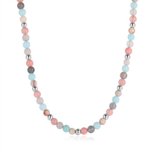 The Kette Pellworm (4mm) necklace combines Pink Jade, Quarz-Kristall, and Roter Netz Jaspis beads, inspired by Quarz-Kristall Schmuck and shown on a white background.